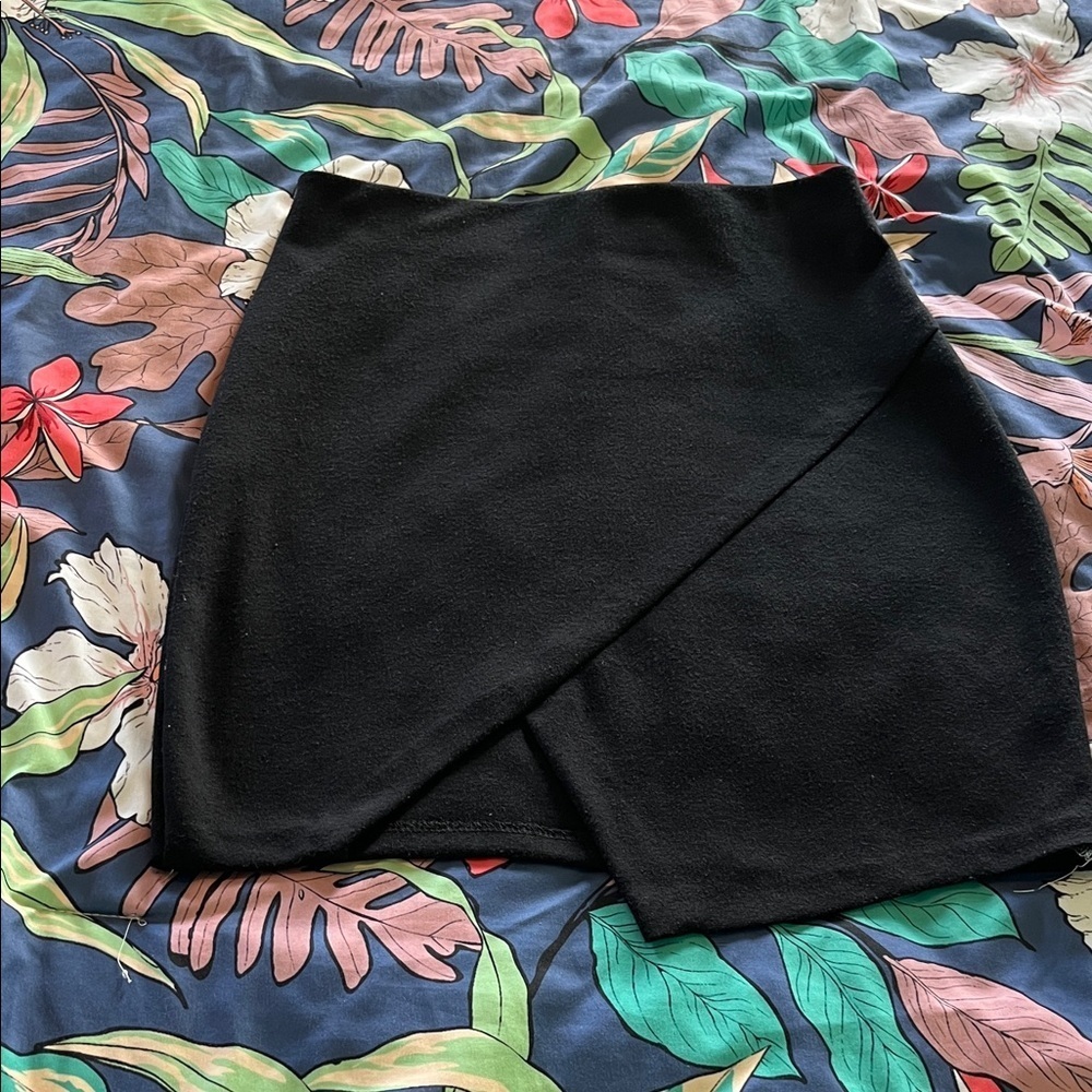 Black asymmetrical mini skirt